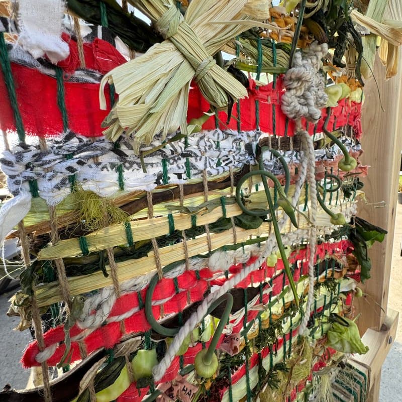 Close-up of woven materials including corn husks and fabric
